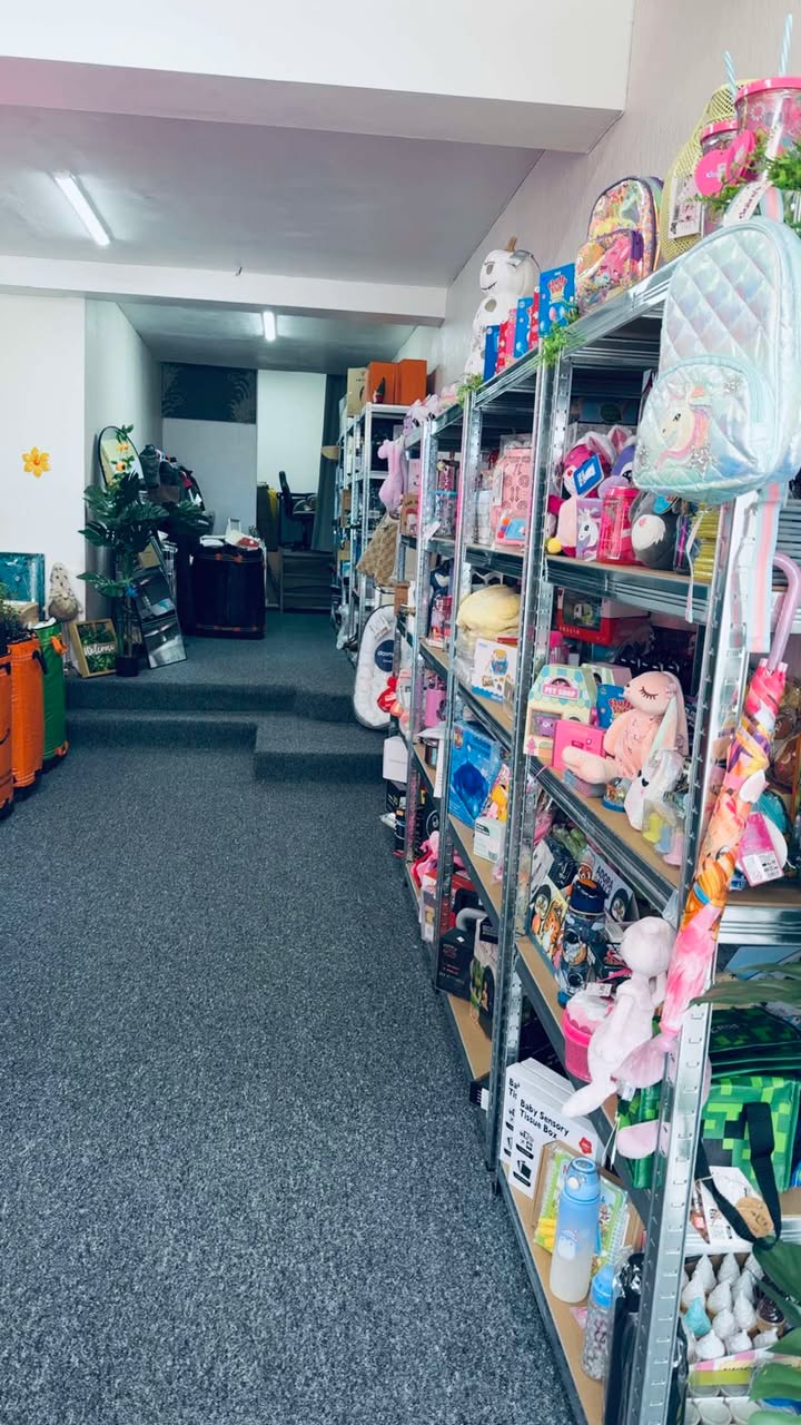 Shelves packed with toys, backpacks and gifts